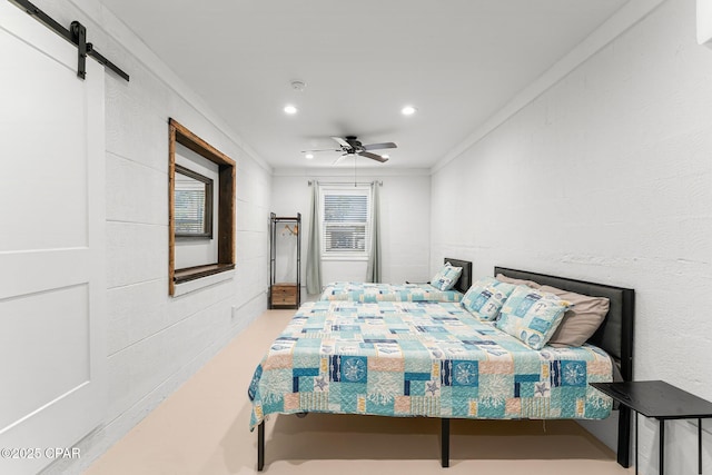 bedroom featuring a barn door, recessed lighting, a ceiling fan, finished concrete flooring, and crown molding