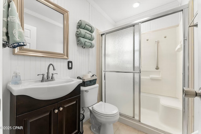 full bathroom with ornamental molding, toilet, a shower stall, and vanity