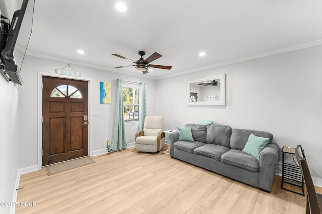 living area featuring light wood-type flooring, baseboards, crown molding, and recessed lighting