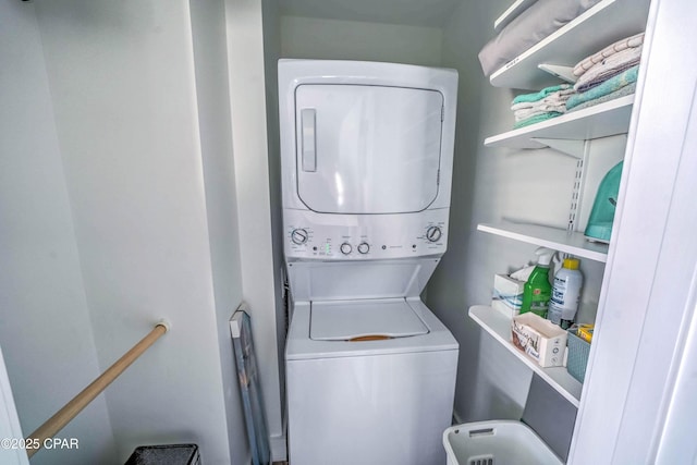 washroom with stacked washer / drying machine