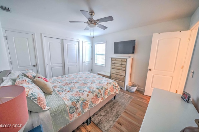 bedroom with ceiling fan and light hardwood / wood-style floors