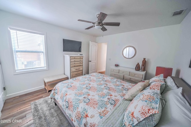 bedroom featuring hardwood / wood-style flooring and ceiling fan