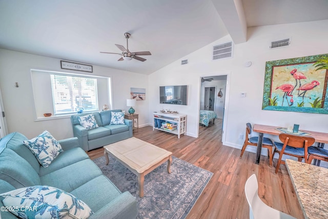 living room with vaulted ceiling with beams, ceiling fan, and wood-type flooring