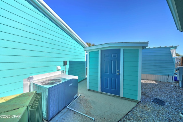 doorway to property featuring cooling unit