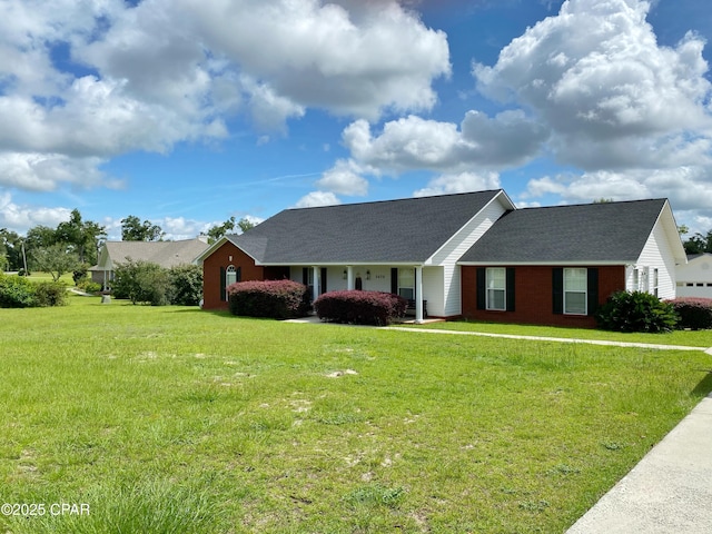 ranch-style home featuring a front yard