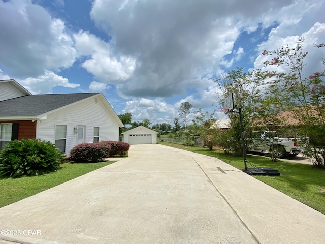 view of home's exterior featuring a garage, a yard, and an outdoor structure