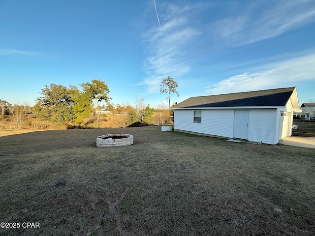 view of yard with an outdoor fire pit