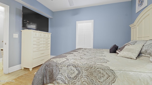 bedroom with ceiling fan and light hardwood / wood-style floors