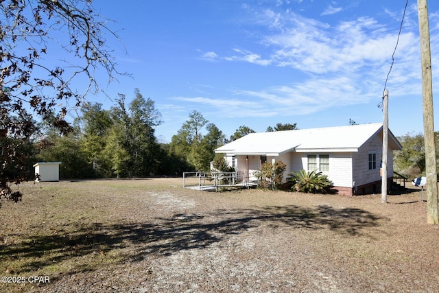 exterior space featuring a shed