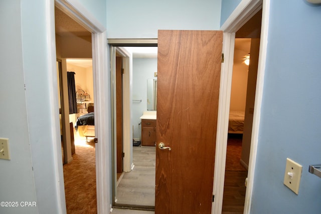 corridor featuring light hardwood / wood-style flooring