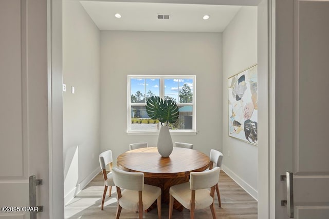 dining space featuring light hardwood / wood-style flooring