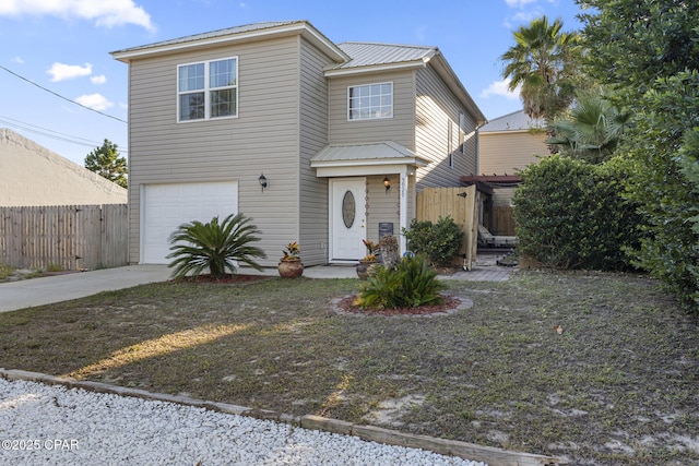 view of property with a front yard and a garage