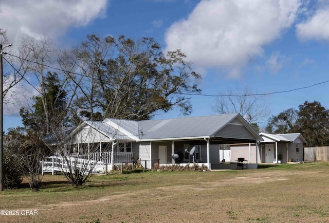 view of front of home with a front yard and covered porch