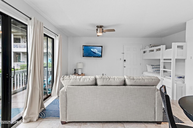 living area featuring a ceiling fan