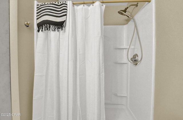 bathroom with a shower with shower curtain