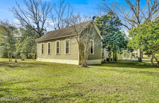 view of property exterior with a lawn