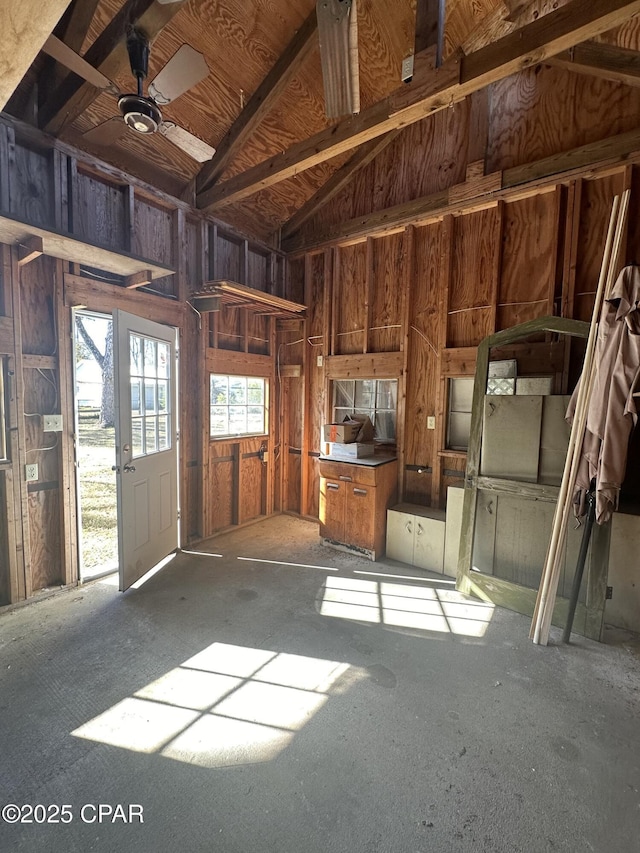 miscellaneous room featuring ceiling fan and lofted ceiling