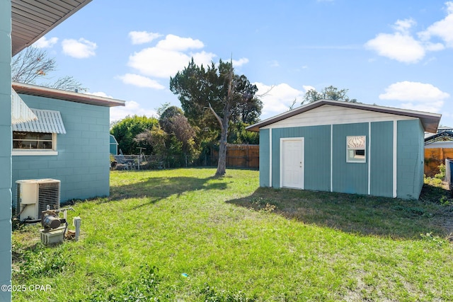 view of yard featuring cooling unit and a storage unit