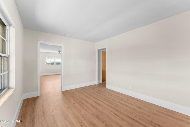 unfurnished room with light wood-type flooring