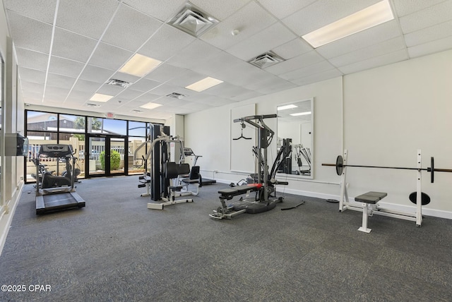 workout area featuring a drop ceiling