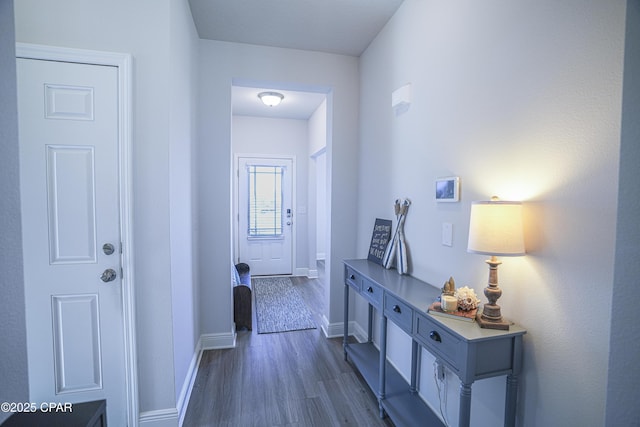 hall with dark hardwood / wood-style floors