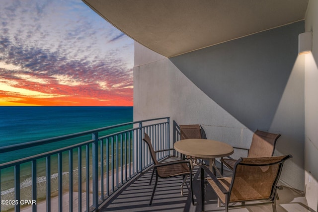 balcony at dusk with a water view