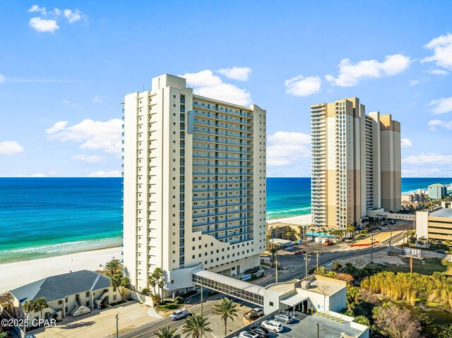 exterior space with a beach view and a water view