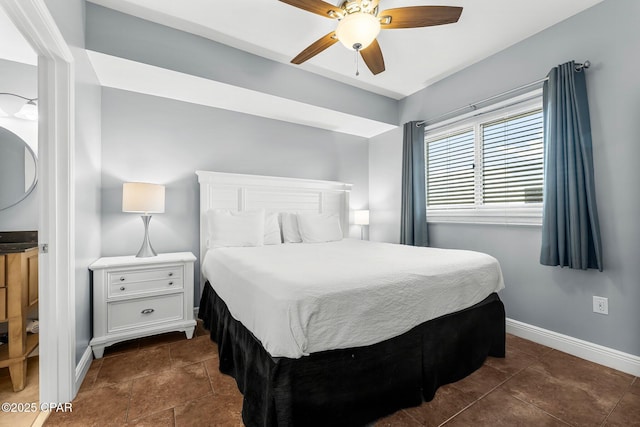 bedroom featuring baseboards and ceiling fan