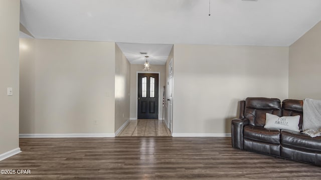 entryway with hardwood / wood-style flooring