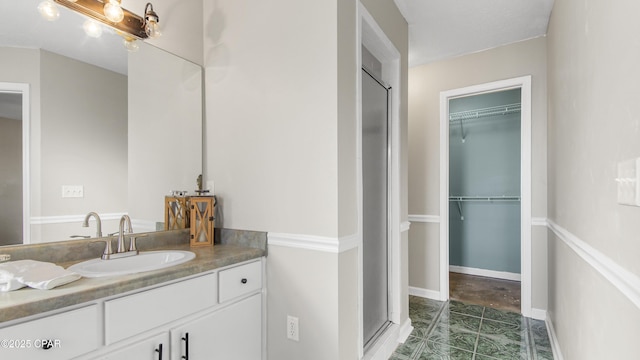 bathroom with vanity and an enclosed shower