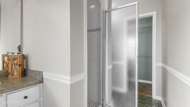 bathroom with a shower with door