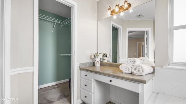 full bath with baseboards, visible vents, concrete flooring, and vanity