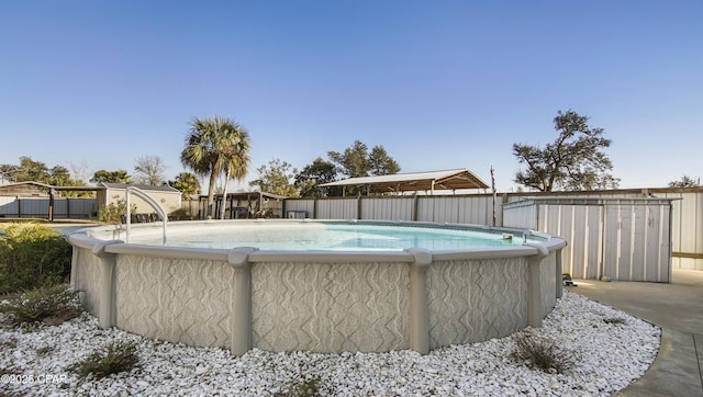 view of pool with fence and a fenced in pool