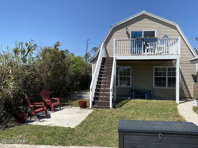 back of house featuring a yard and a patio