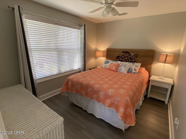 bedroom featuring dark hardwood / wood-style floors and ceiling fan