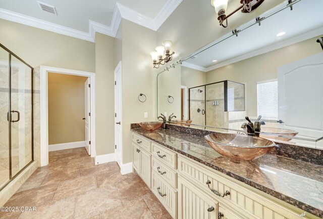 bathroom featuring vanity, ornamental molding, and walk in shower