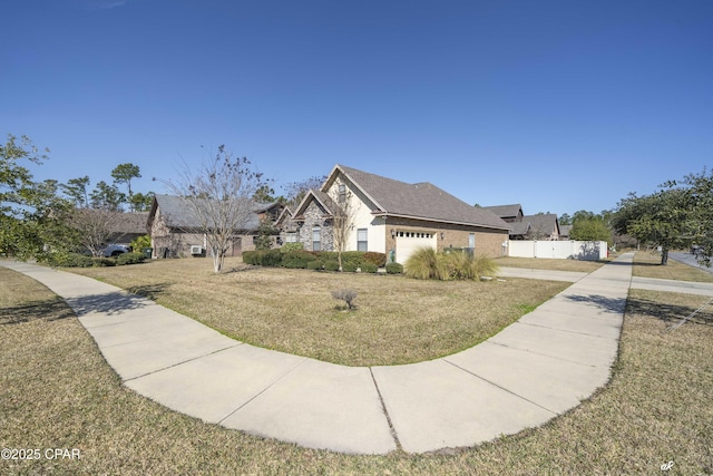 view of front of property with a garage and a front yard