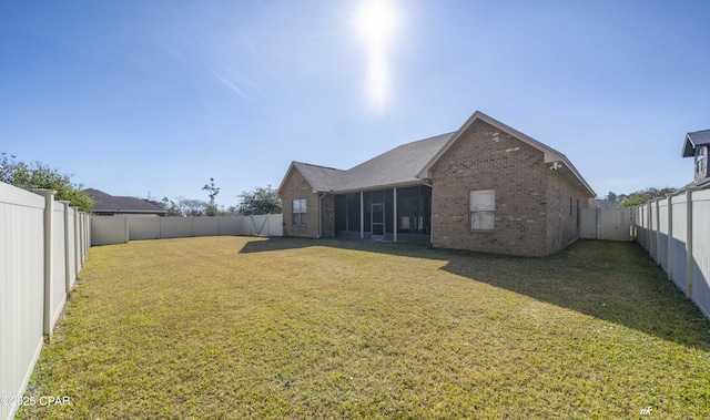 back of house featuring a lawn