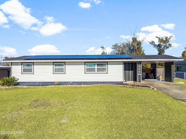 view of front facade featuring a carport and a front lawn