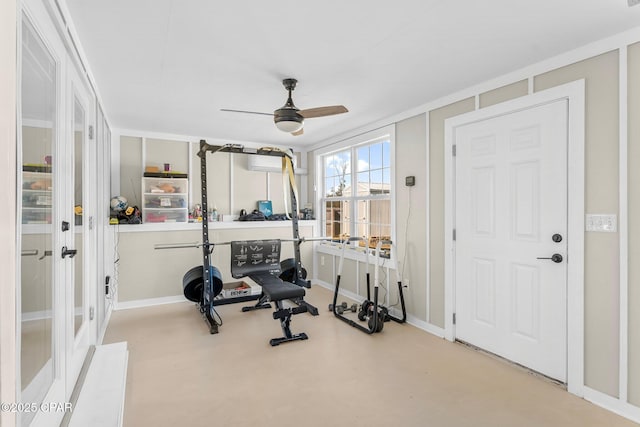 exercise area featuring french doors and ceiling fan