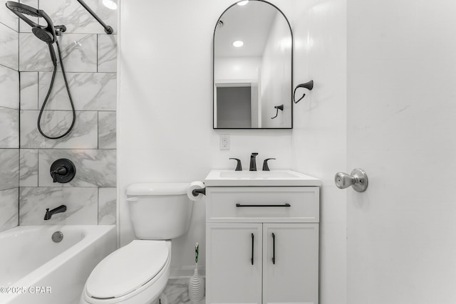 full bathroom with vanity, toilet, and tiled shower / bath combo