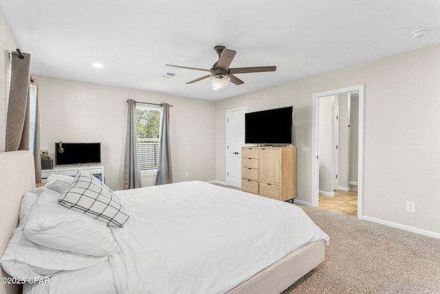 carpeted bedroom with ceiling fan