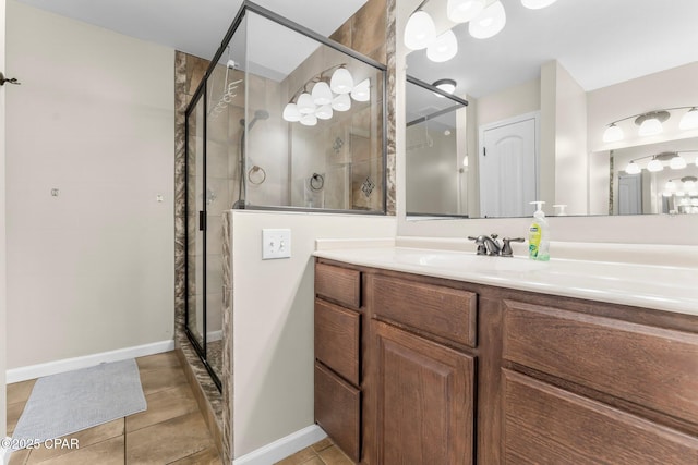 bathroom with vanity, tile patterned floors, and walk in shower