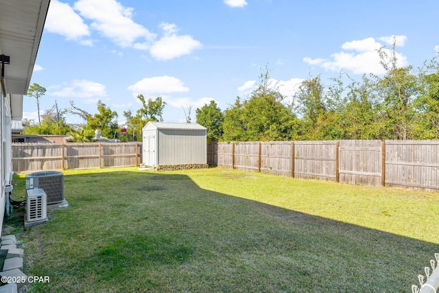 view of yard featuring central AC and a shed