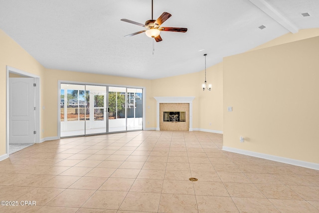 unfurnished living room featuring vaulted ceiling with beams, light tile patterned floors, and ceiling fan with notable chandelier