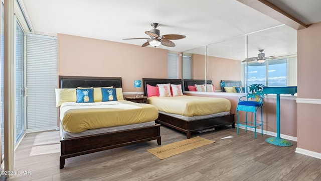 bedroom featuring ceiling fan and hardwood / wood-style floors