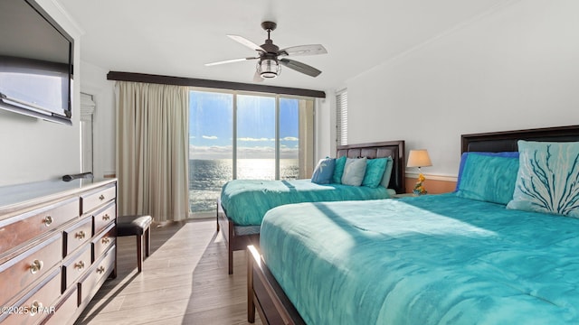 bedroom featuring ceiling fan and light wood-type flooring