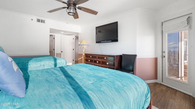 bedroom with access to outside, ceiling fan, crown molding, and wood-type flooring