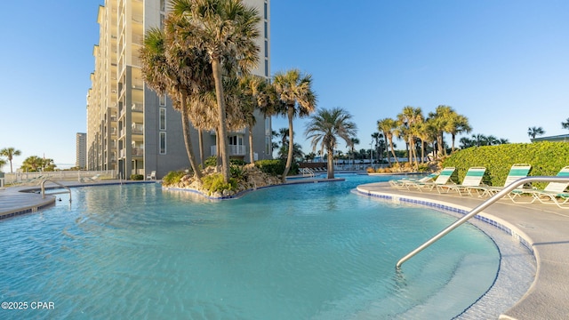 view of swimming pool featuring a patio area