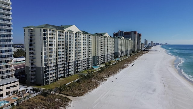 view of property featuring a water view and a view of the beach